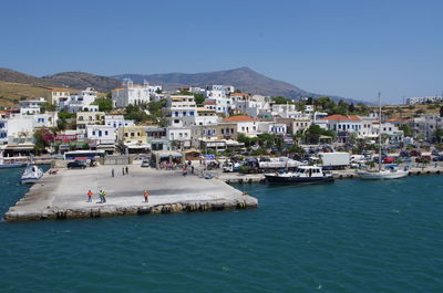 Town by sea against clear sky