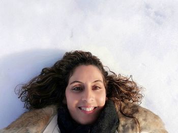 Portrait of smiling young woman outdoors