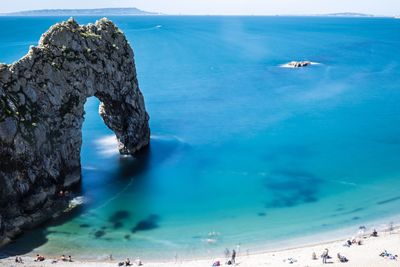 Scenic view of sea against blue sky