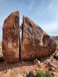 Low angle view of rock formations against sky