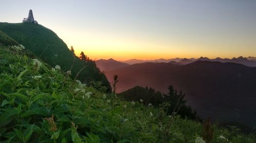 Scenic view of mountains against sky during sunset