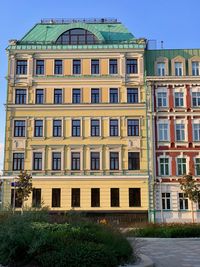 Low angle view of building against blue sky