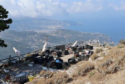 High angle view of buildings by sea against sky