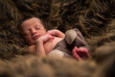 Cute baby sleeping on bed