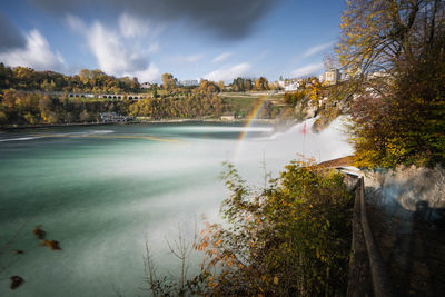 Scenic view of waterfall against sky