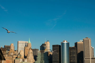 Low angle view of buildings against blue sky