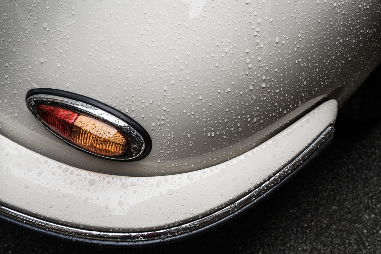 CLOSE-UP OF WATER DROPS ON CAR