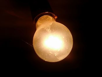 Low angle view of illuminated light bulb