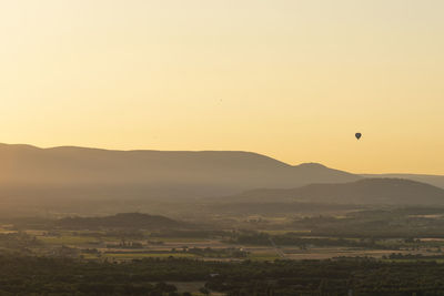 Scenic view of landscape against sky during sunset