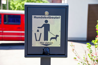 Close-up of please clean up after your pet sign