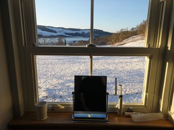 View of sea through window