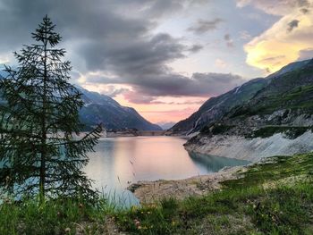 Scenic view of lake against sky during sunset