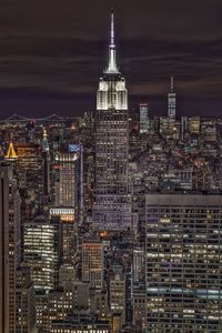 Illuminated buildings in city at night