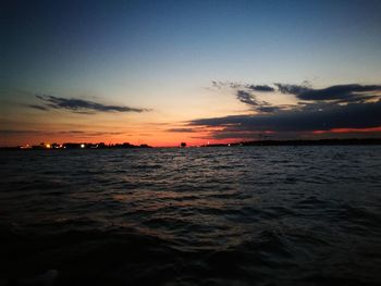 Scenic view of sea against sky at sunset