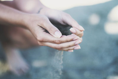 Close-up of hand holding water