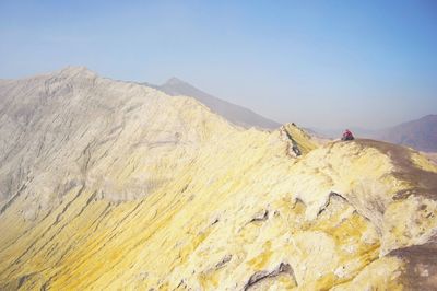 Scenic view of a volcanic mountain against sky
