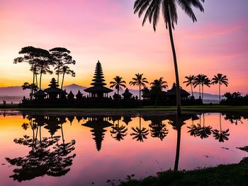 Scenic view of lake against sky during sunset
