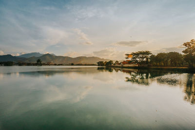 Scenic view of lake against sky during sunset