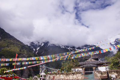 Panoramic view of buildings and mountains against sky