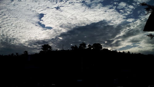 Silhouette trees against sky