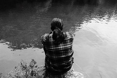 Rear view of woman in lake