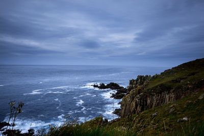 Scenic view of sea against cloudy sky