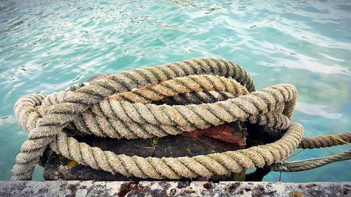 High angle view of rope tied on shore