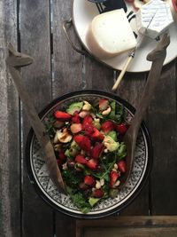 High angle view of salad served in plate on wooden table