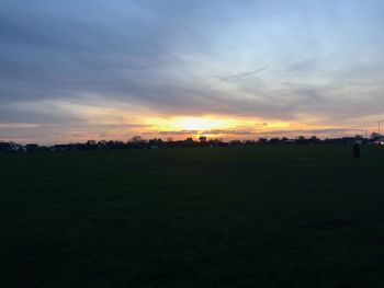 Scenic view of landscape at sunset