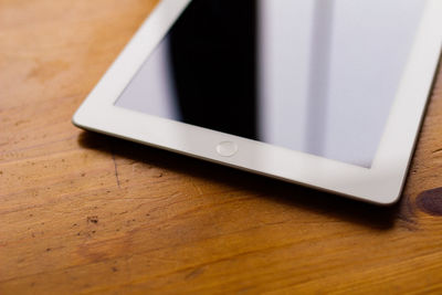 Close-up of digital tablet on table