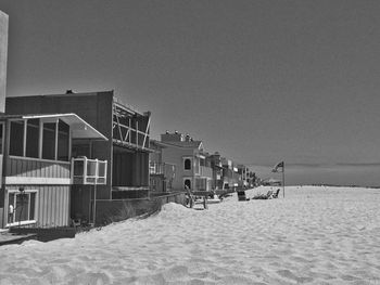 Lifeguard hut on beach against sky