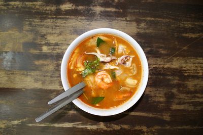 Directly above shot of tom yum in bowl on table