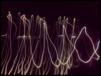 Close-up of light trails against black background