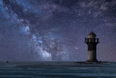 Scenic view of sea against sky at night