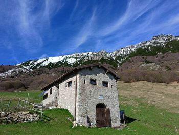 House on field against sky