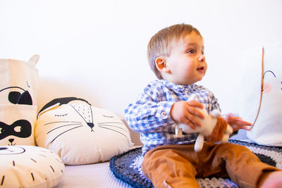 Cute boy sitting at home