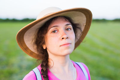 Close-up portrait of a girl wearing hat