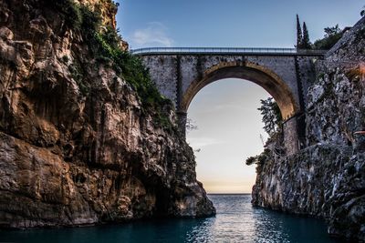 Bridge over sea against sky