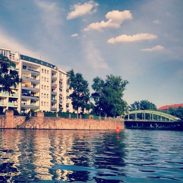 architecture, built structure, water, building exterior, waterfront, sky, tree, cloud - sky, reflection, river, rippled, cloud, house, canal, residential structure, residential building, day, outdoors, lake, building