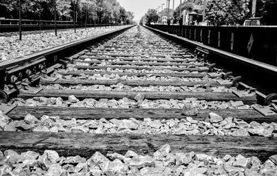 Diminishing perspective of railroad tracks during sunny day