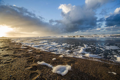 Scenic view of sea against sky during winter