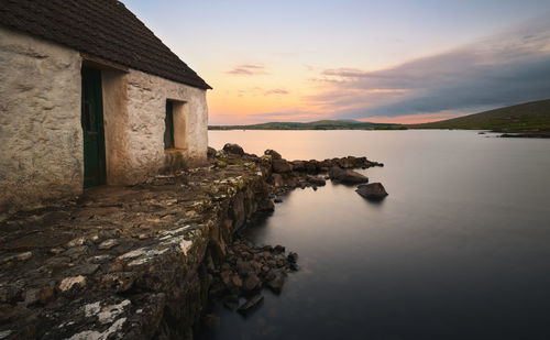  lakeside sunrise scenery of fisherman's hut   at screebe in connemara ,county galway ,ireland