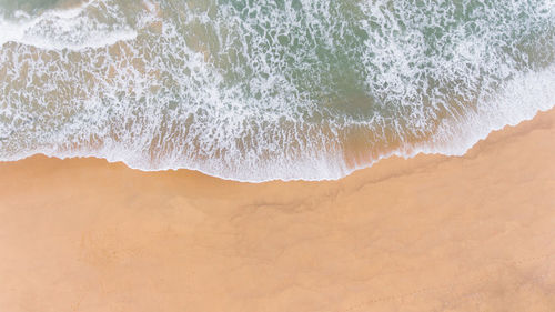 Aerial view of tropical beach and sea wave