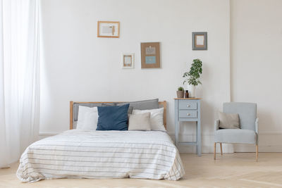 Interior of white and gray cozy bedroom