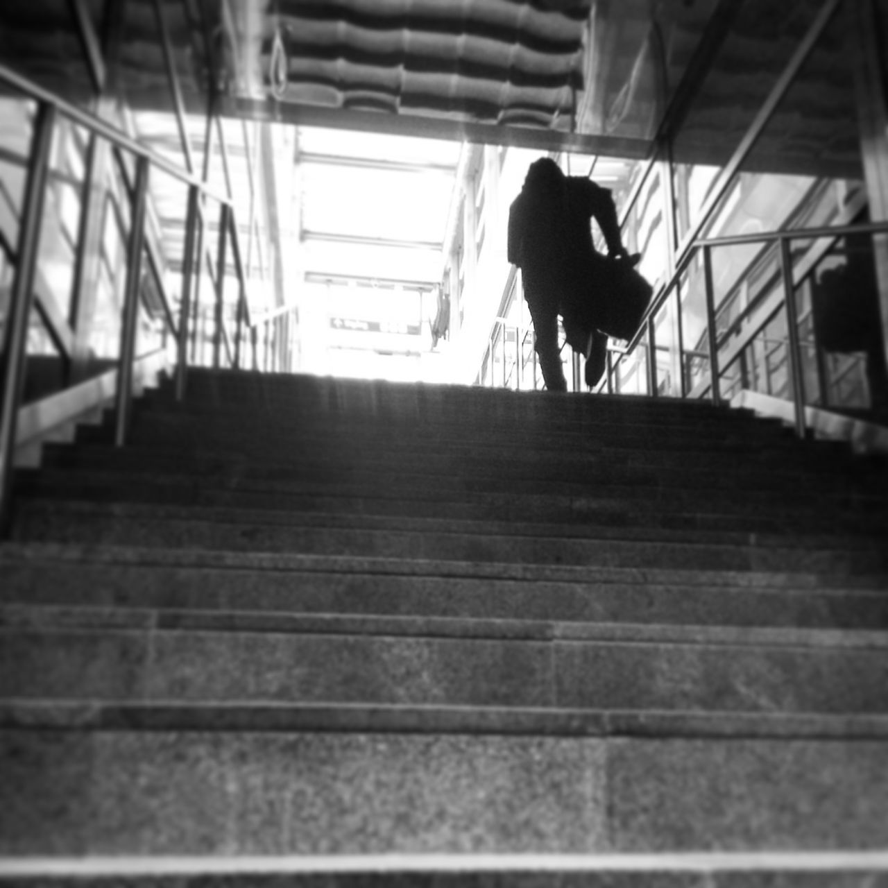 indoors, full length, walking, steps, men, rear view, lifestyles, steps and staircases, staircase, silhouette, railing, person, the way forward, escalator, architecture, built structure, leisure activity