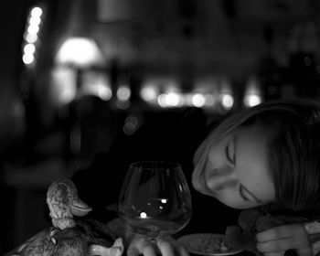 Close-up of woman relaxing on table at restaurant