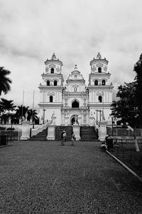 Low angle view of church against cloudy sky