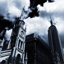 Low angle view of building against cloudy sky