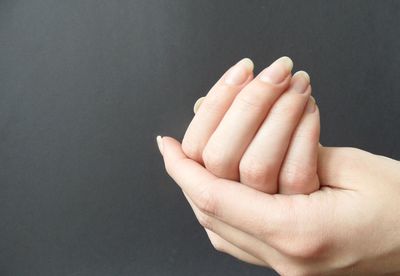 Close-up of woman cupping hands