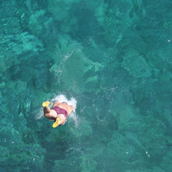 High angle view of man diving into sea